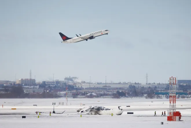 “Delta Plane Crashes and Flips Over at Toronto Airport”